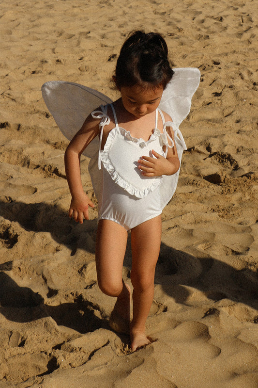 Heart-Shaped Swimwear for little girls and toddlers in white colorblock with ruffles and sleeveless Front photo lifestyle