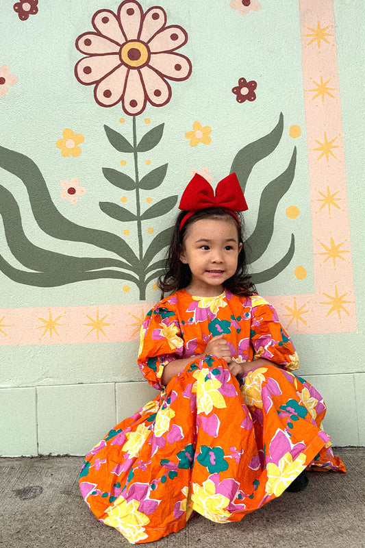 Maxi Floral Dress in orange multicolour long puffy sleeves oversize fun and playful front photo lifestyle - Sailor and Sunny