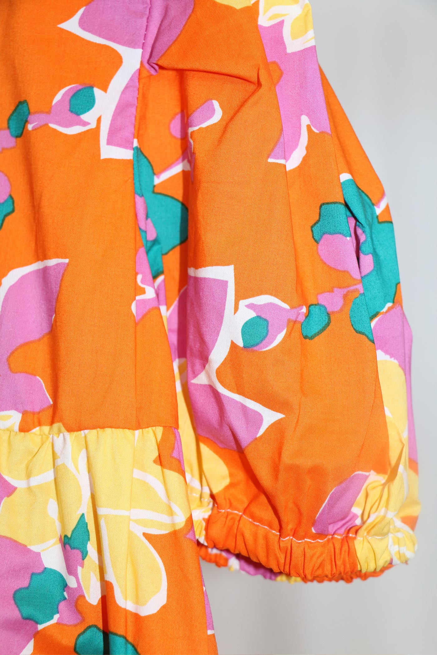 Maxi Floral Dress in orange multicolour long puffy sleeves oversize fun and playful front photo flat lay - Sailor and Sunny