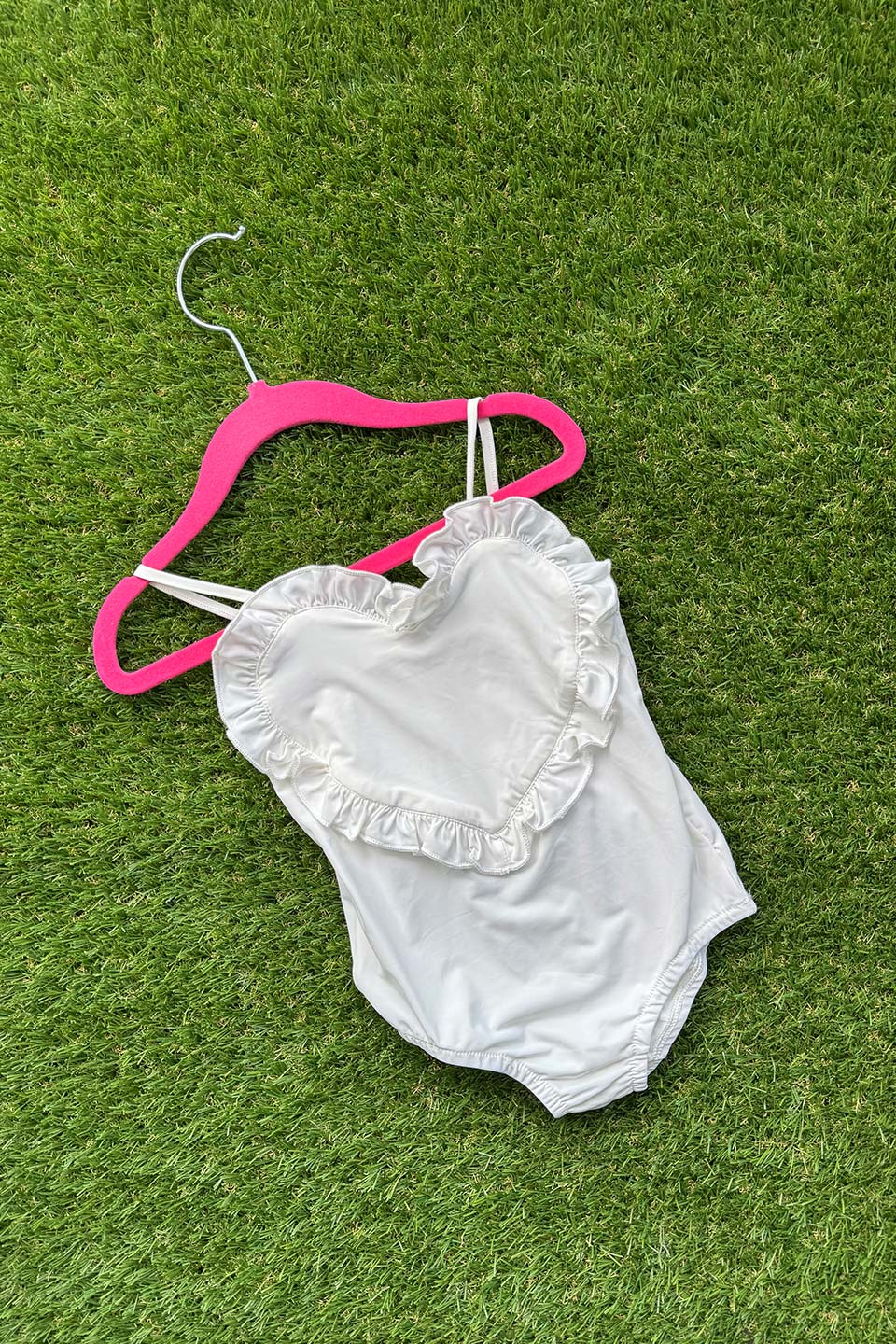 Heart-Shaped Swimwear for little girls and toddlers in white colorblock with ruffles and sleeveless Front photo flat lay
